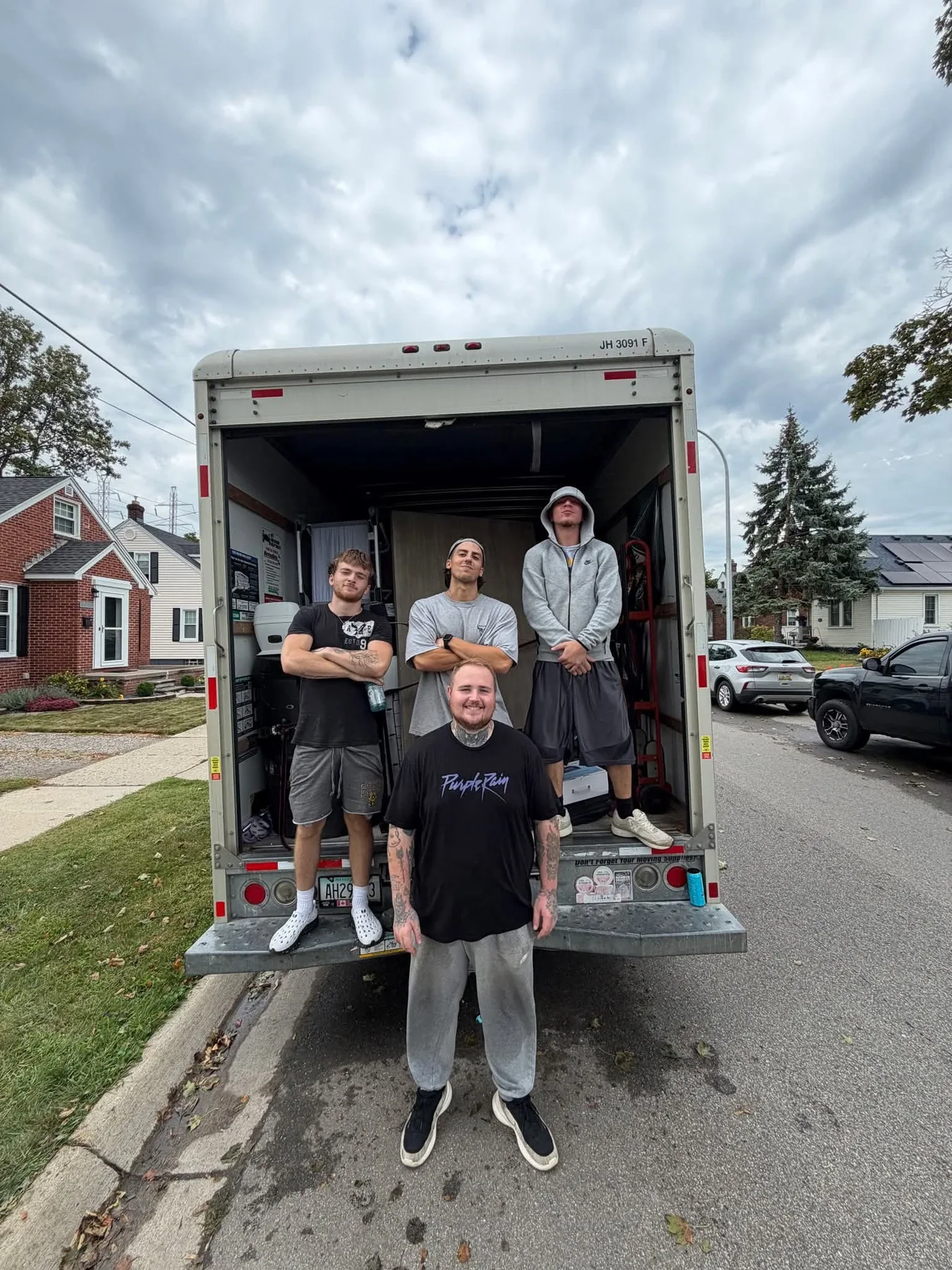 The Great Lakes crew beside a moving truck